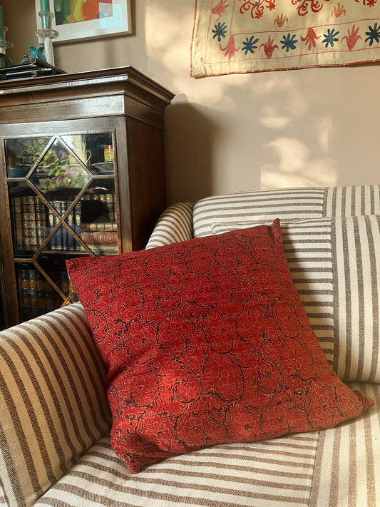 Red cushion with striped backing