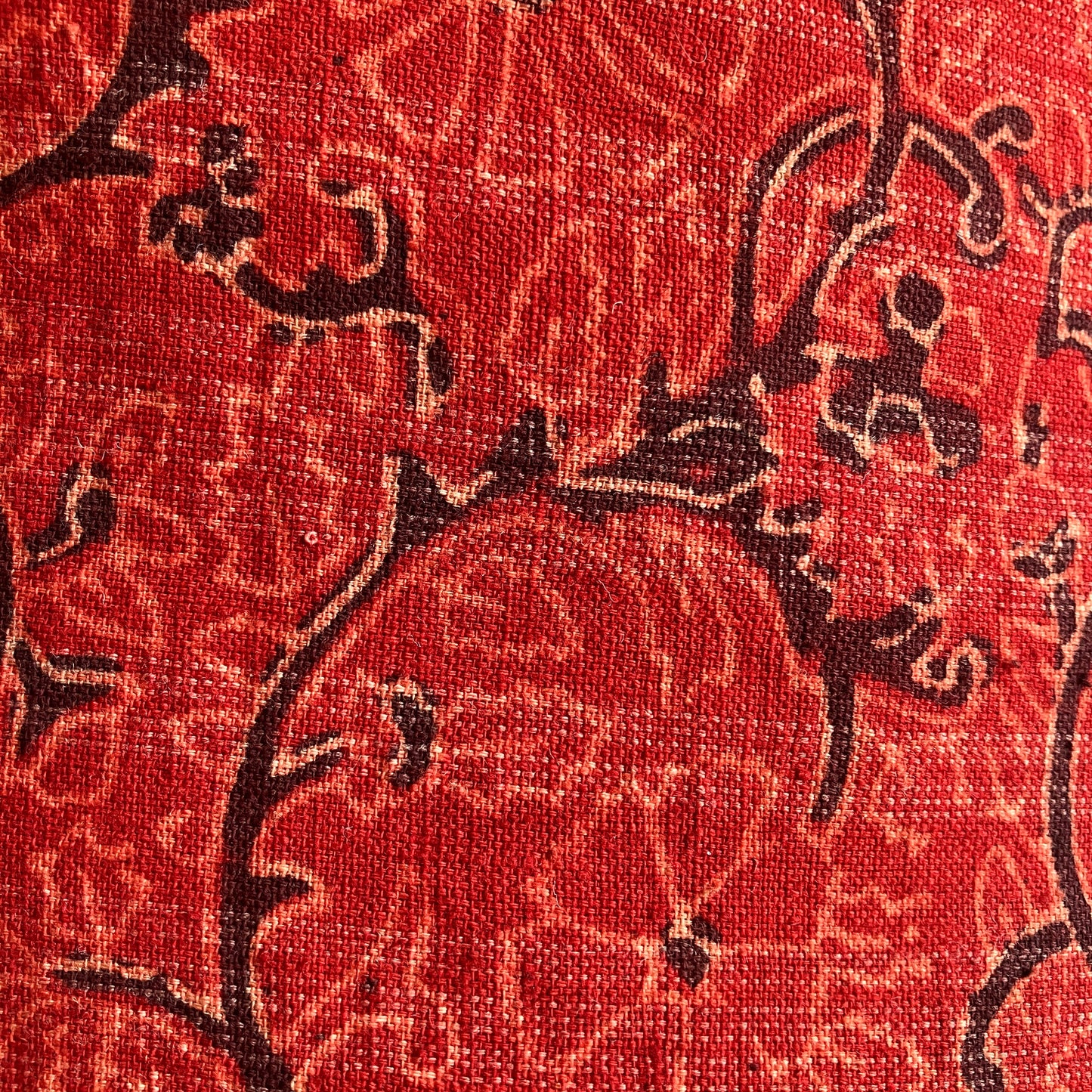 Red cushion with striped backing