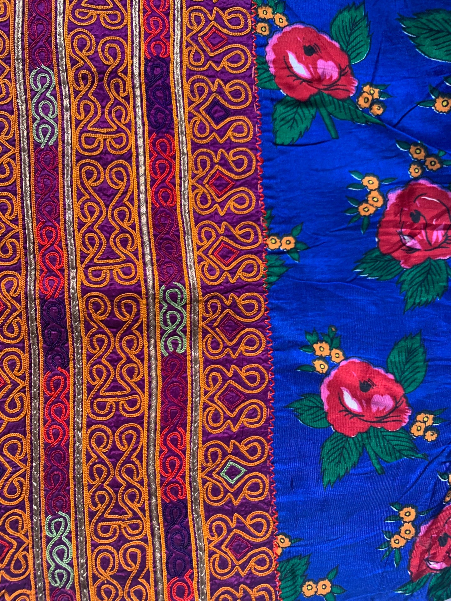 TEXTILE WITH ORANGE EMBROIDERY